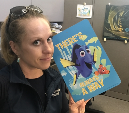 woman holding "Finding Dory" greeting card