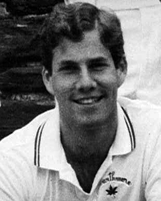 Shepard “Shep” Davidson ’86, wears a white shirt and is a five-time All-American for the men’s tennis team during one of the program’s most successful runs. 