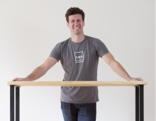 Ben Young ’09 with one of his company’s handcrafted tables.