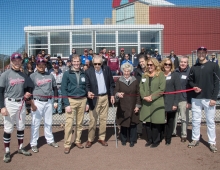 a crowd assembles to celebrate new developments on the baseball field