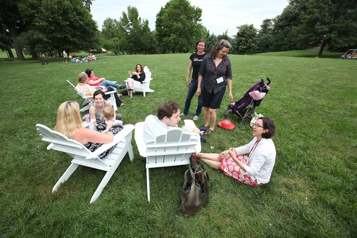 Group of alums relaxing and chatting on Swarthmore campus