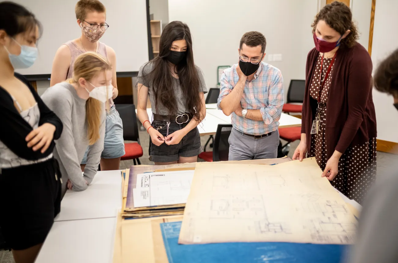 Architecture of Philadelphia class visits McCabe library to view drawings and plans.