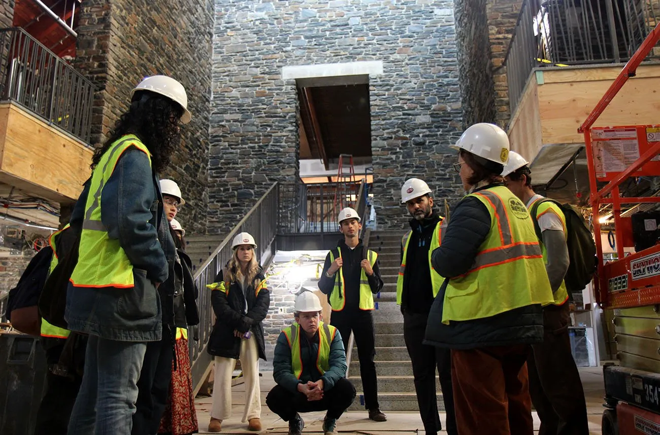 art students in construction hats