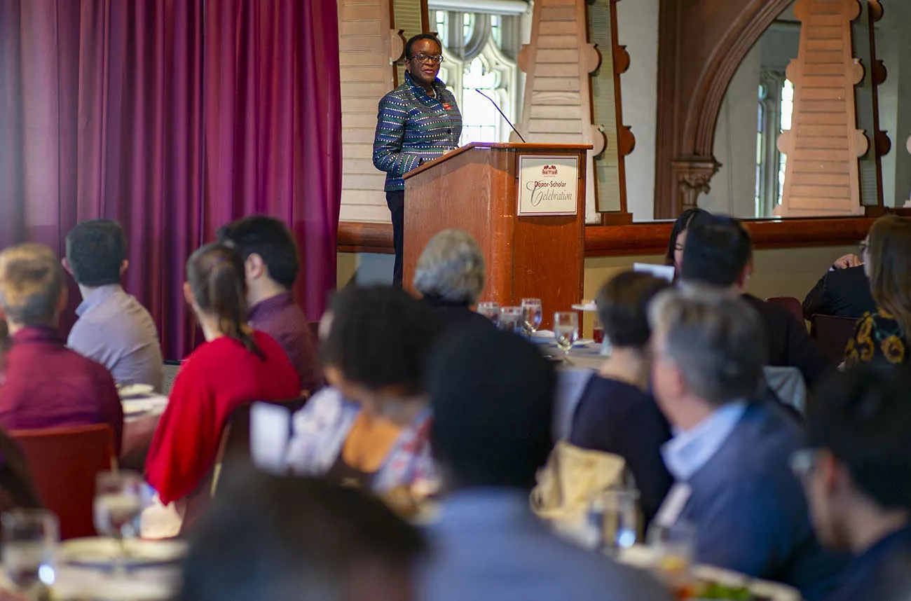 val smith speaking at alumni luncheon