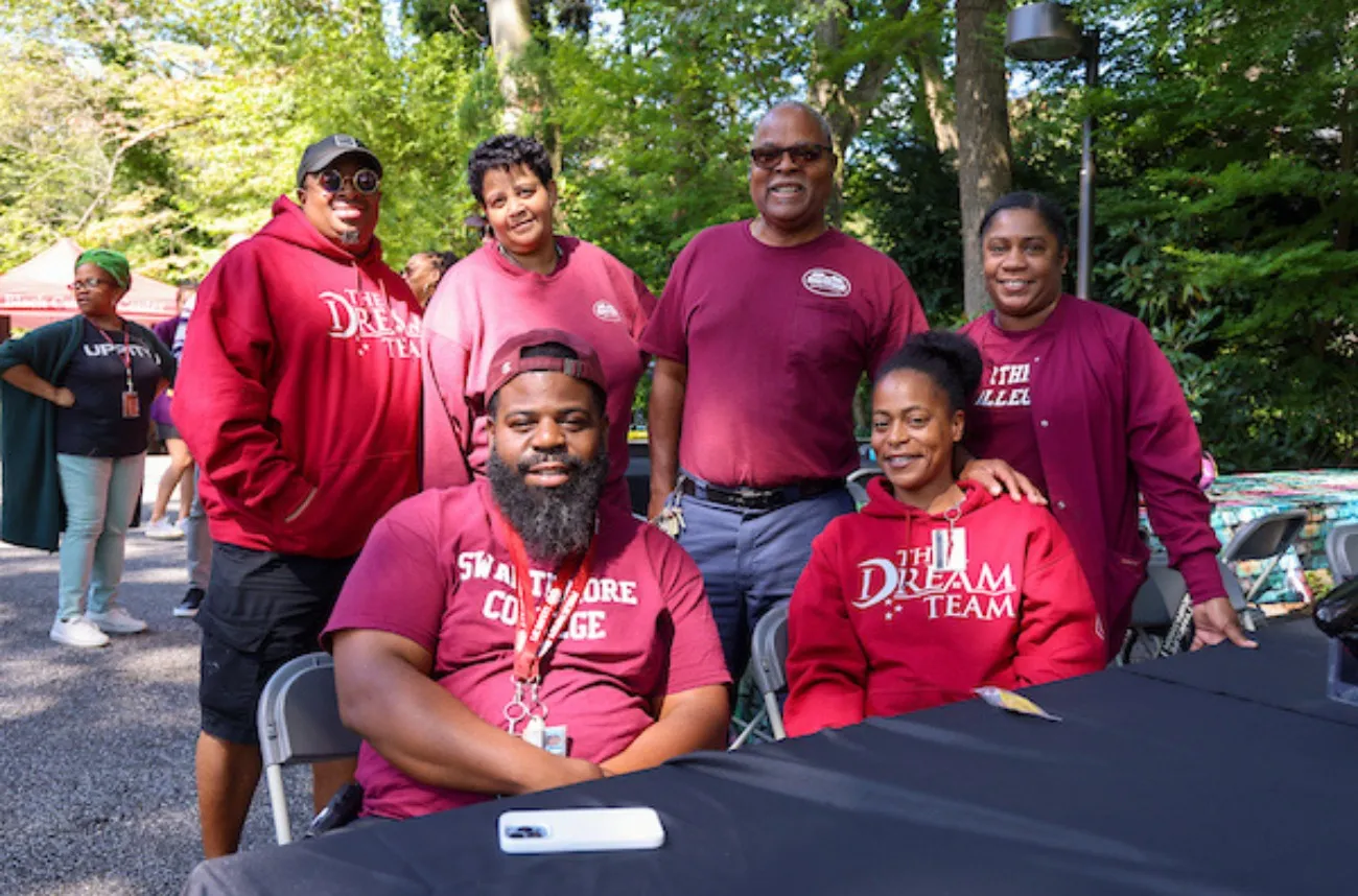 Staff members pose outside