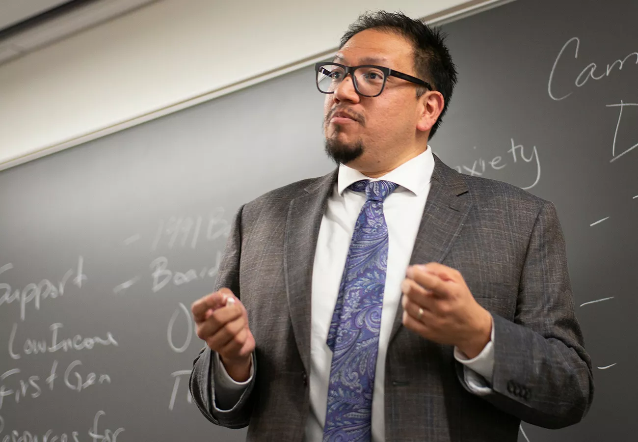 Edwin Mayorga in front of blackboard