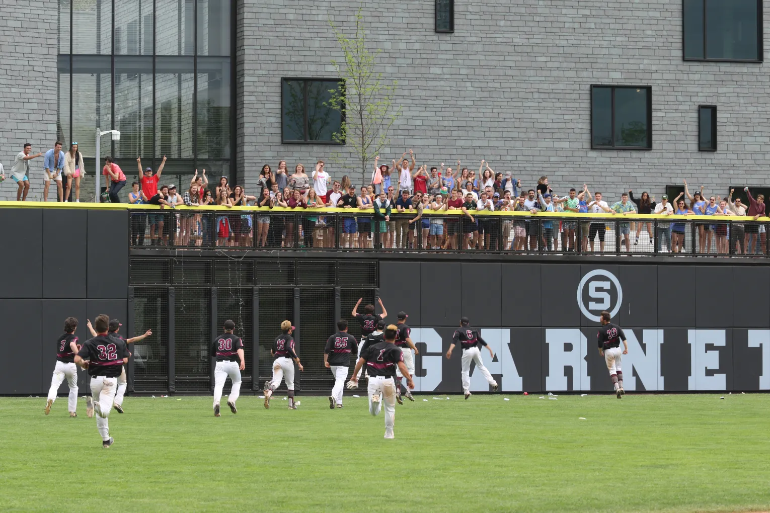 Swarthmore's baseball team celebrates with fans