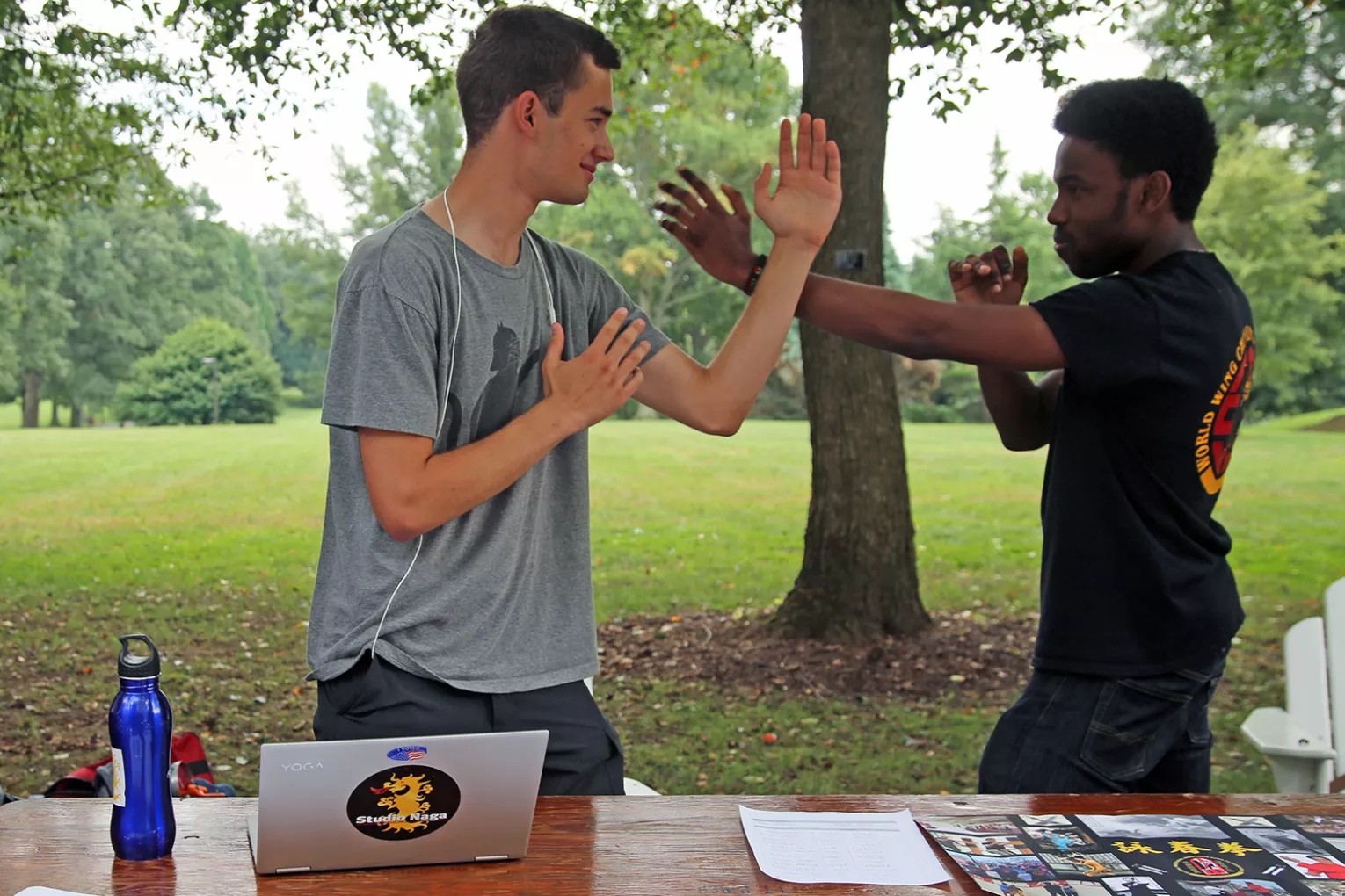 Two students mime fighting