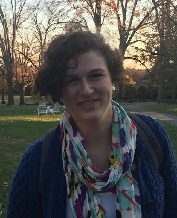 Headshot of Kemmer Cope '17. She is outdoors, wearing a scarf, and smiling at the camera.