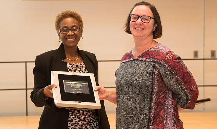 Annette Newman receiving an award