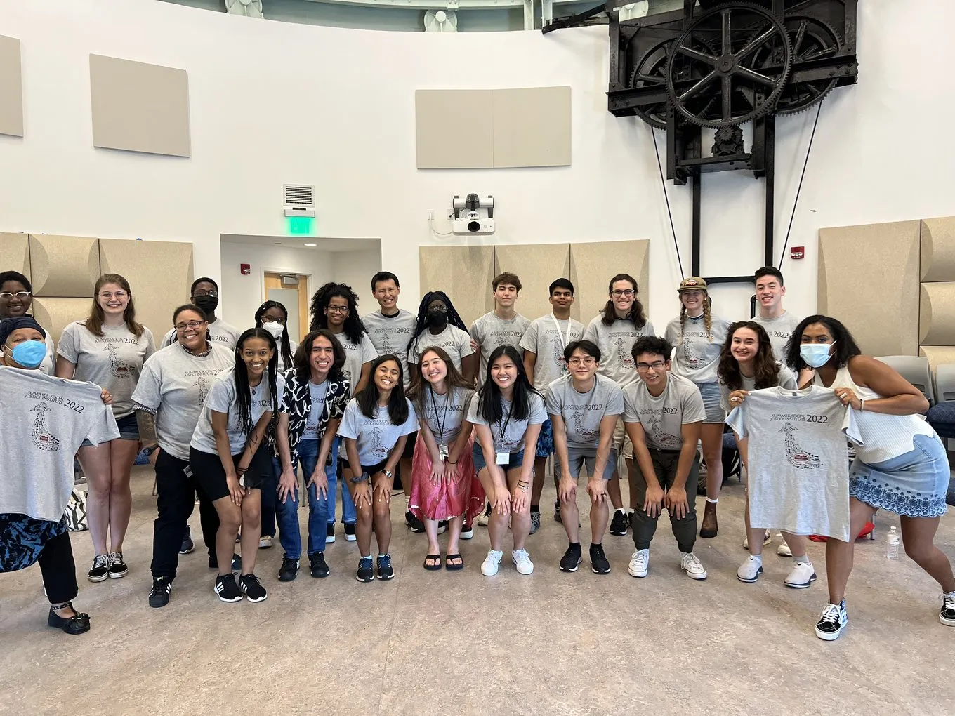 ssji participants in gray shirts smiling in the IC dome