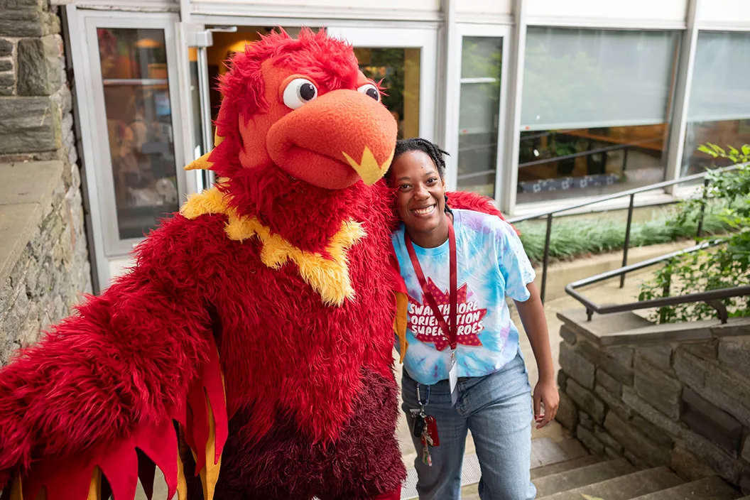 Phineas the Phoenix poses with new student orientation team member