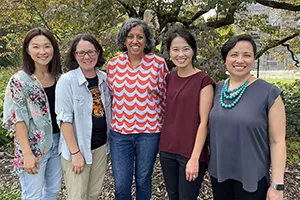 Asian American studies faculty pose outside