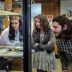 Digitization techs examine documents in exhibit