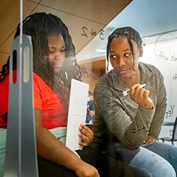 Tutor works with student on math