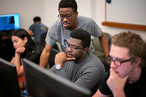 Students work at computers in lab