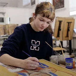 Student paints fresco