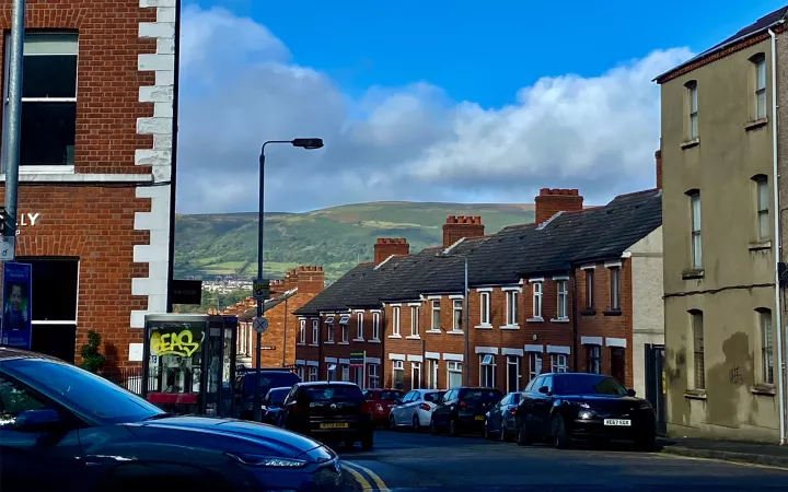 View of road through town with mountain in background