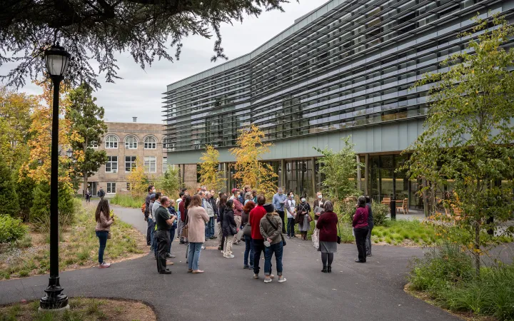 People take tour of building in fall