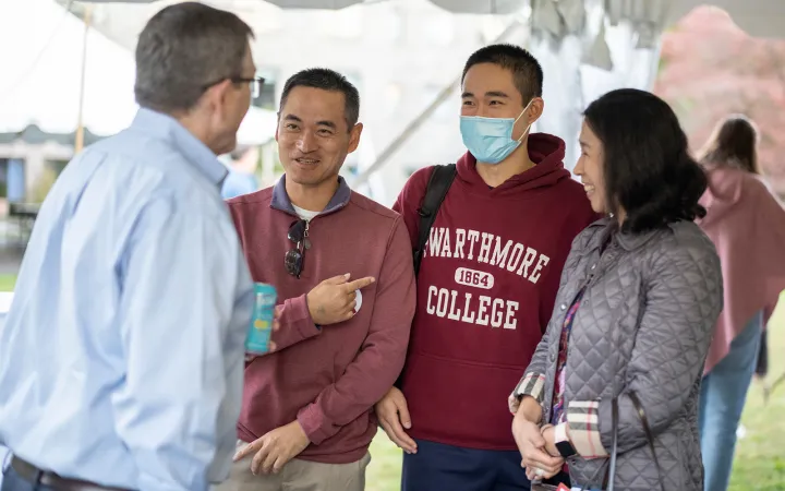 People wearing Swarthmore College sweaters talk