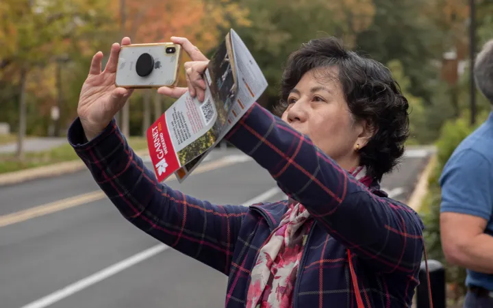 Person takes photo with camera phone