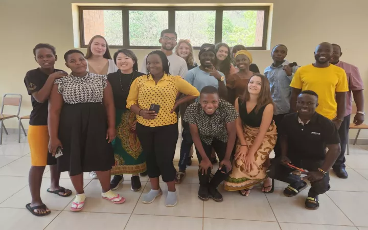 Group photo in large room indoors