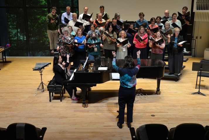 Choir sings with piano accompaniment