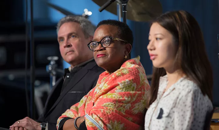 President Valerie Smith listens on