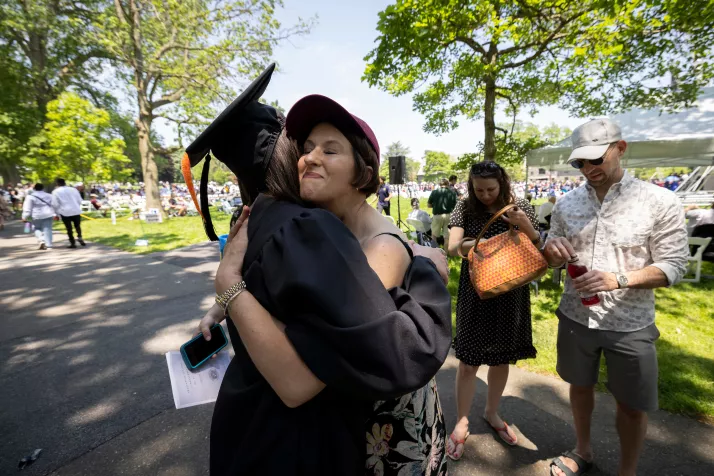 Graduates hug