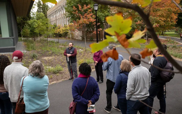 People take tour of building in fall