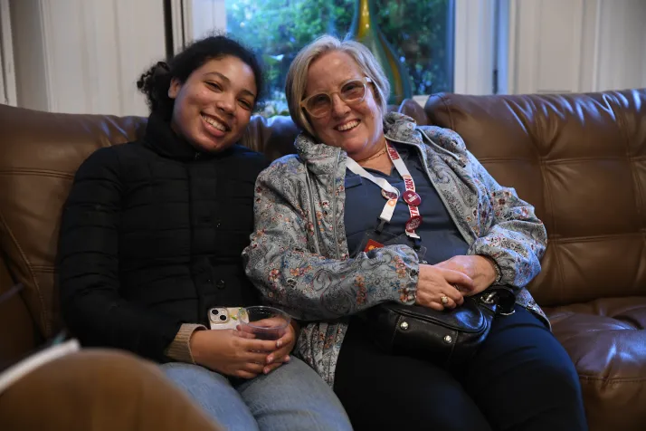 Two people sitting on a couch