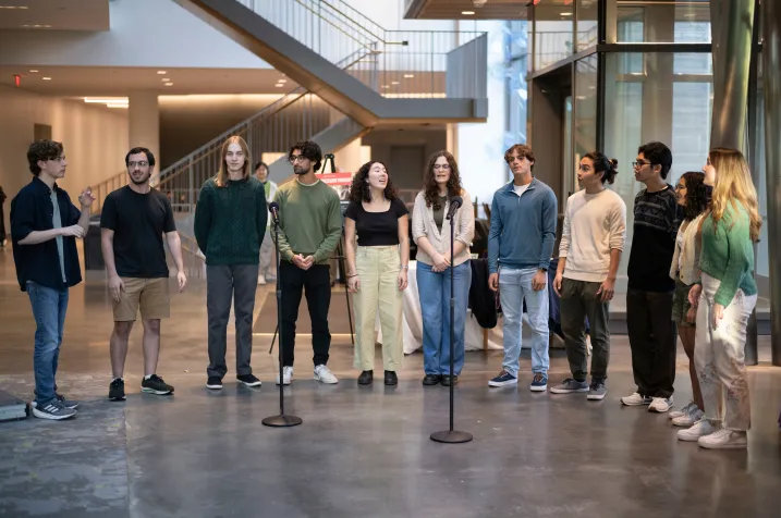 Members of a cappella group perform in Singer Hall