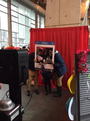 Students pose in a photobooth