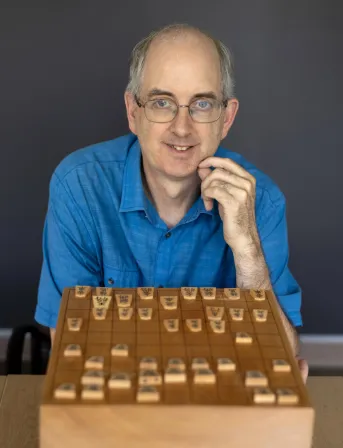 Alan Baker with a shogi board