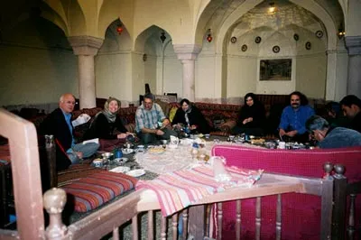 People gathered at table in Tehran 