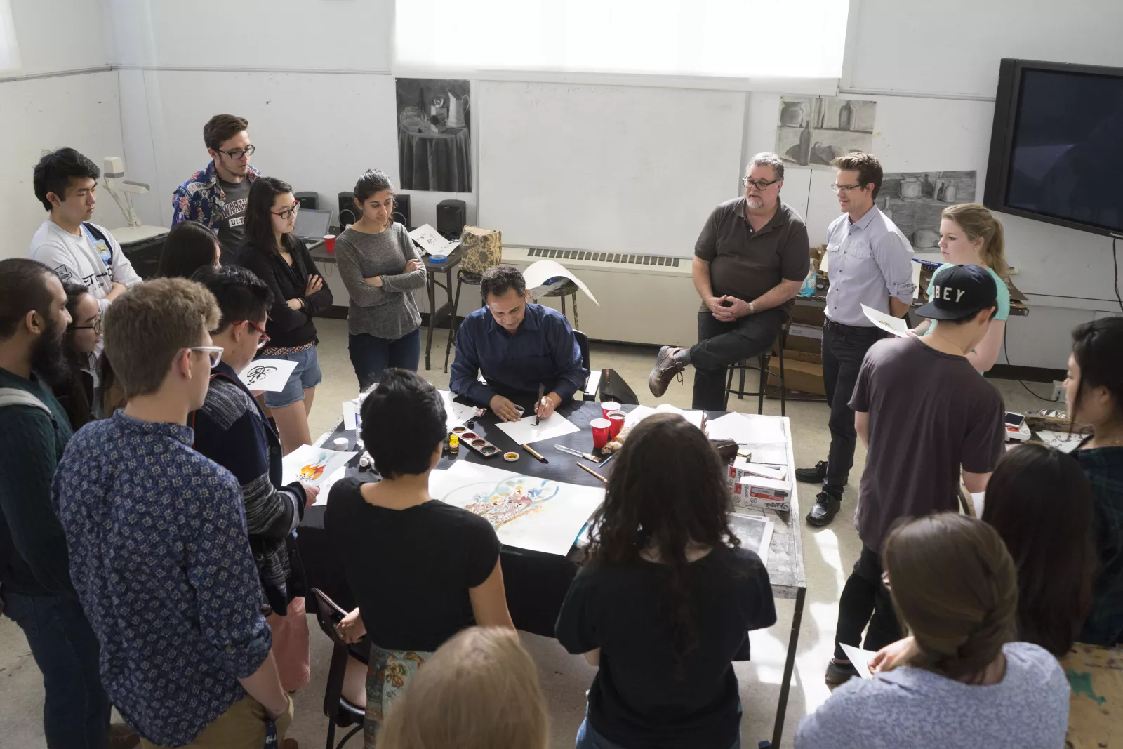 Students and faculty gather for calligraphy demo