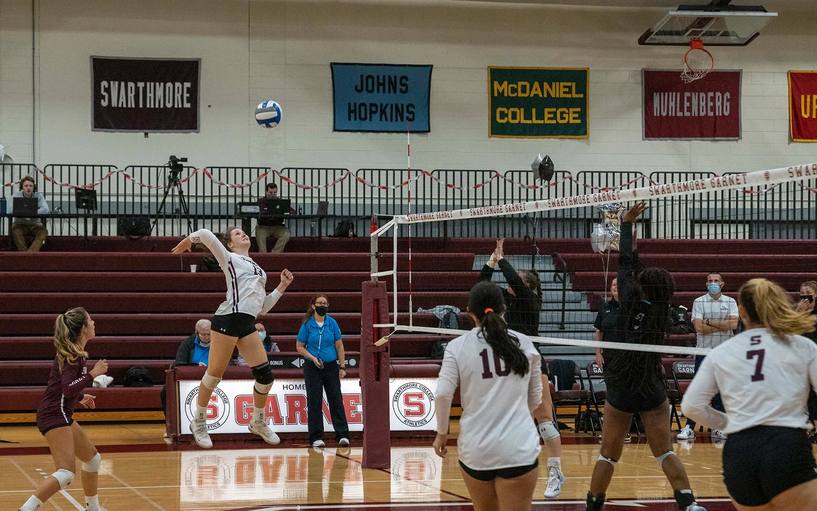 Volleyball player prepares to spike ball