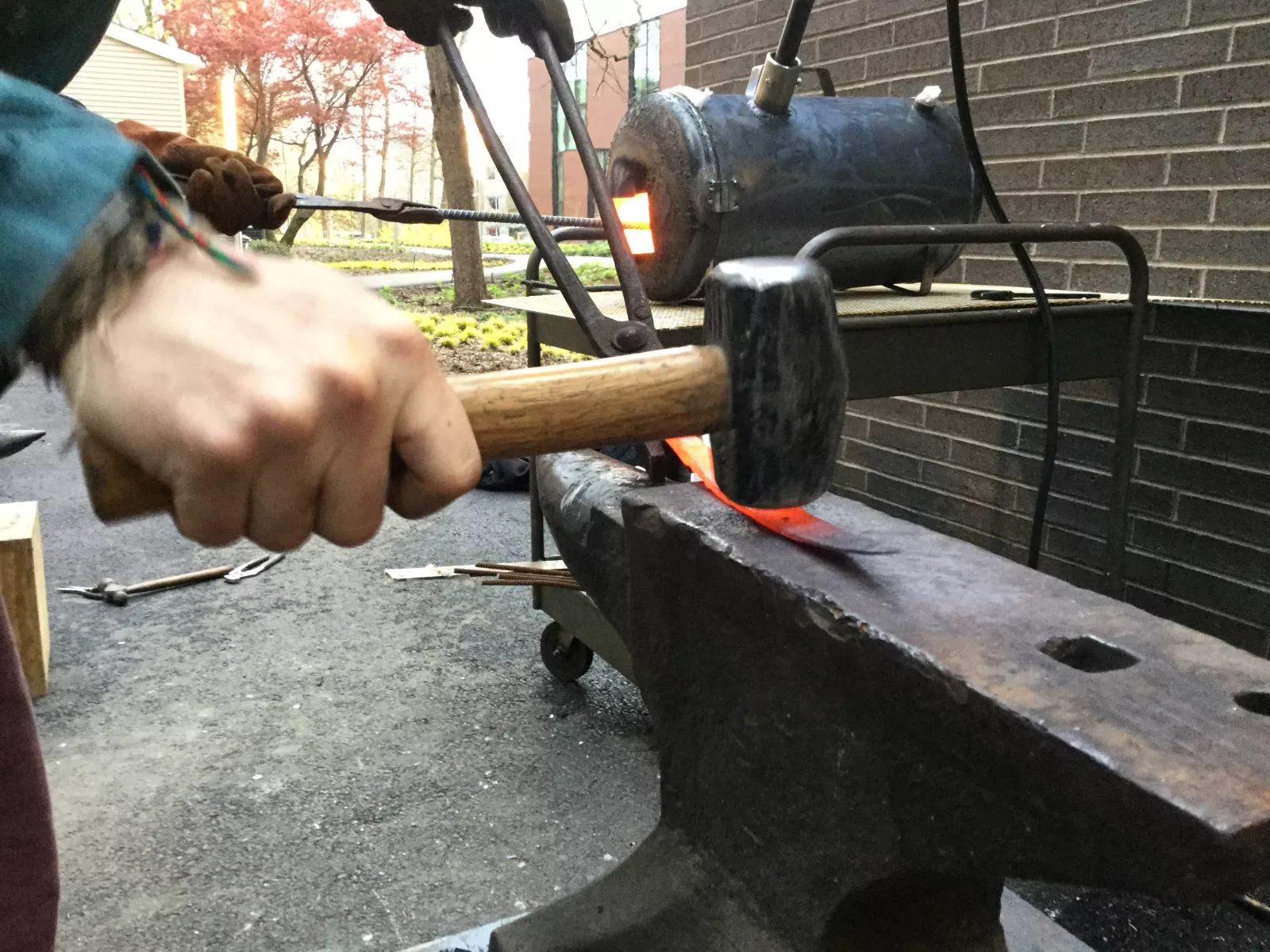 A hammer striking an anvil