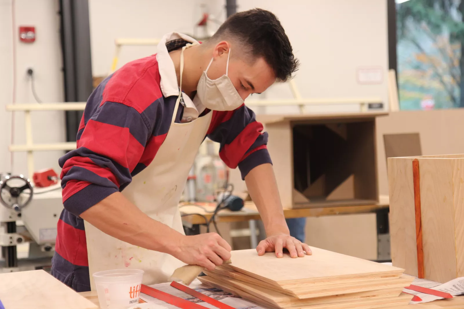 Sculpture I course. Student working inside MakerSpace fabrication area.