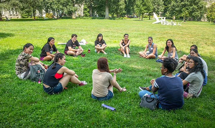 Students get to know each other in circle on Parrish Beach