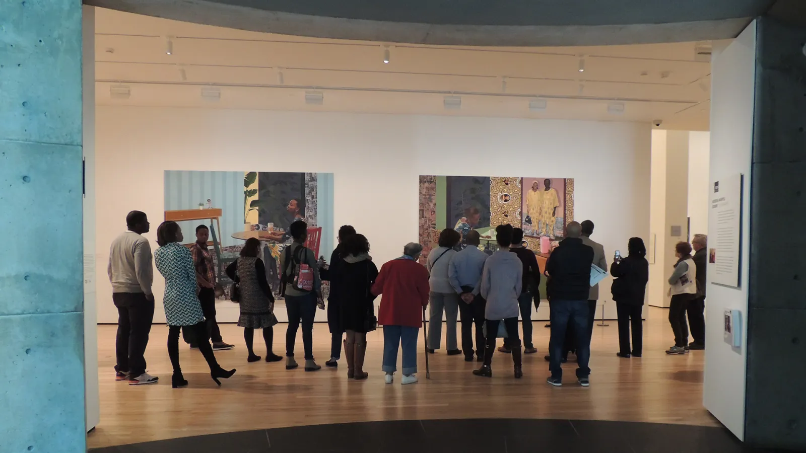 SBAN Alums gather in front Njideka Akunyili Crosby '04's art at the BMA