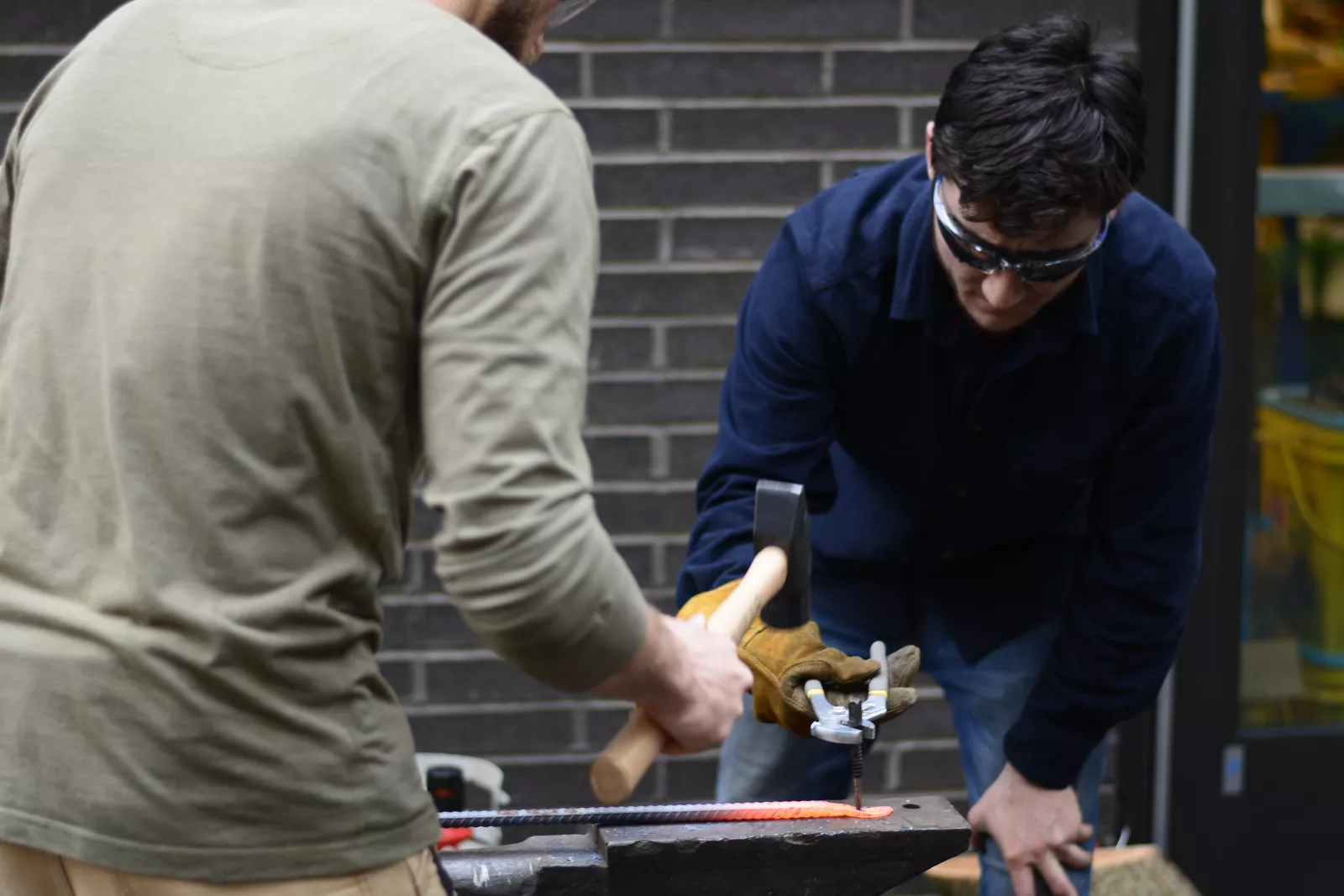 Students work on shaping metals