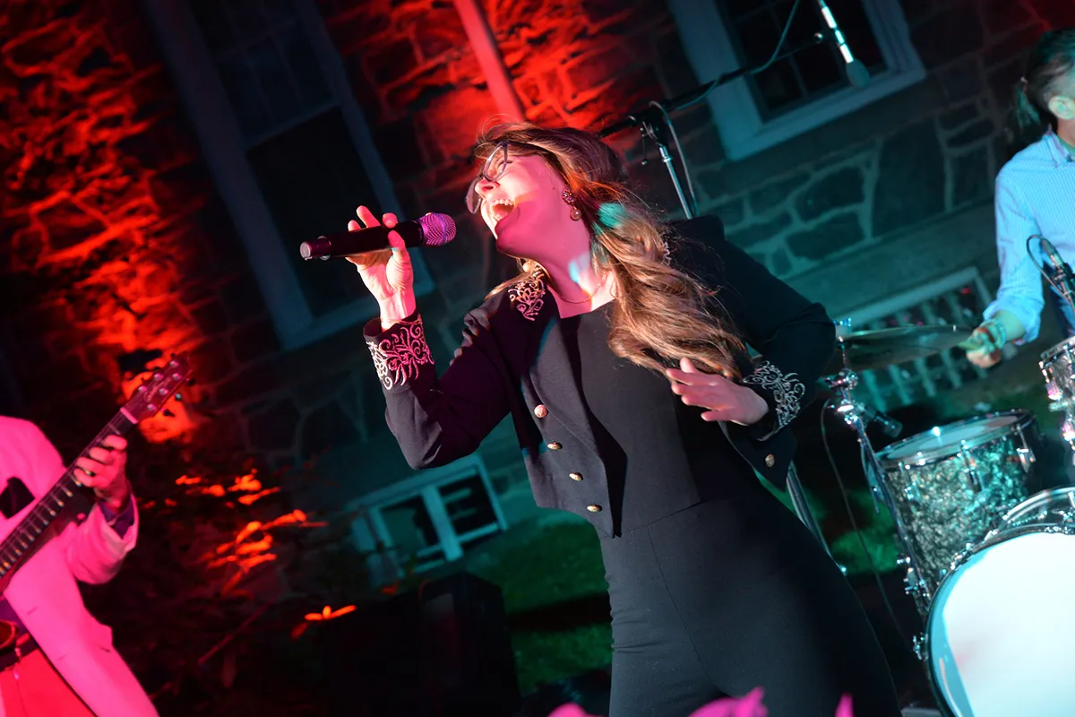 Woman sings during outdoor performance