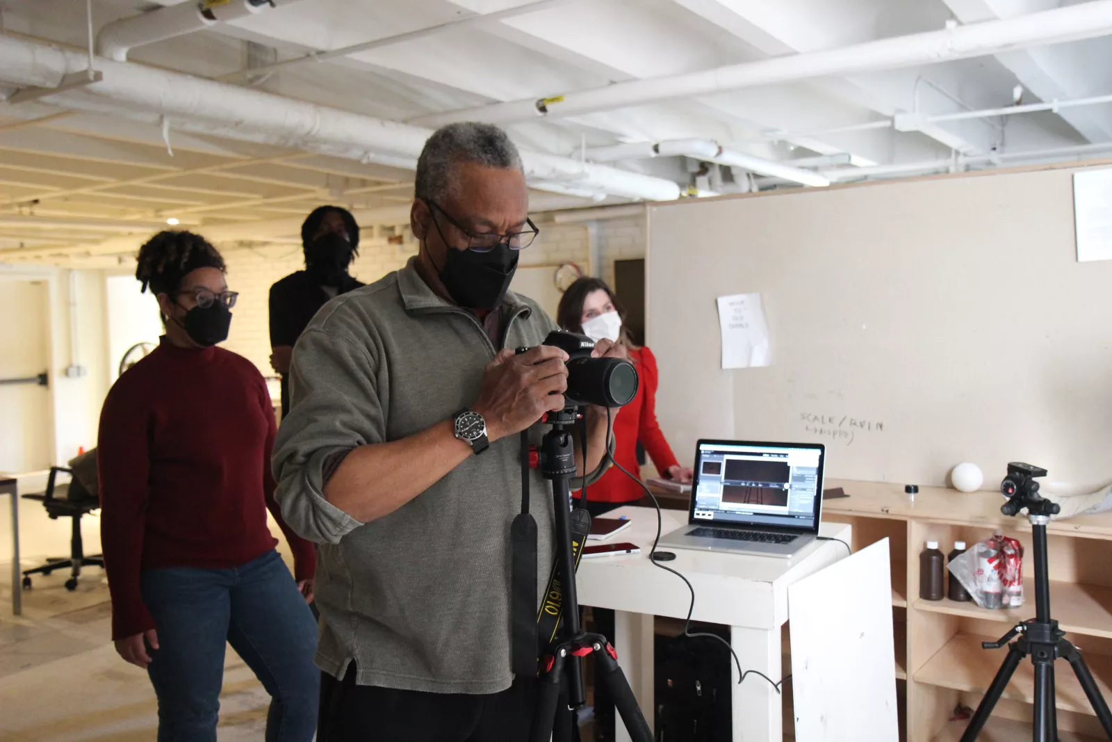 Photography portrait lab. Professor Ron Tarver leading a portrait lesson for Photography II: The Long Term Project.