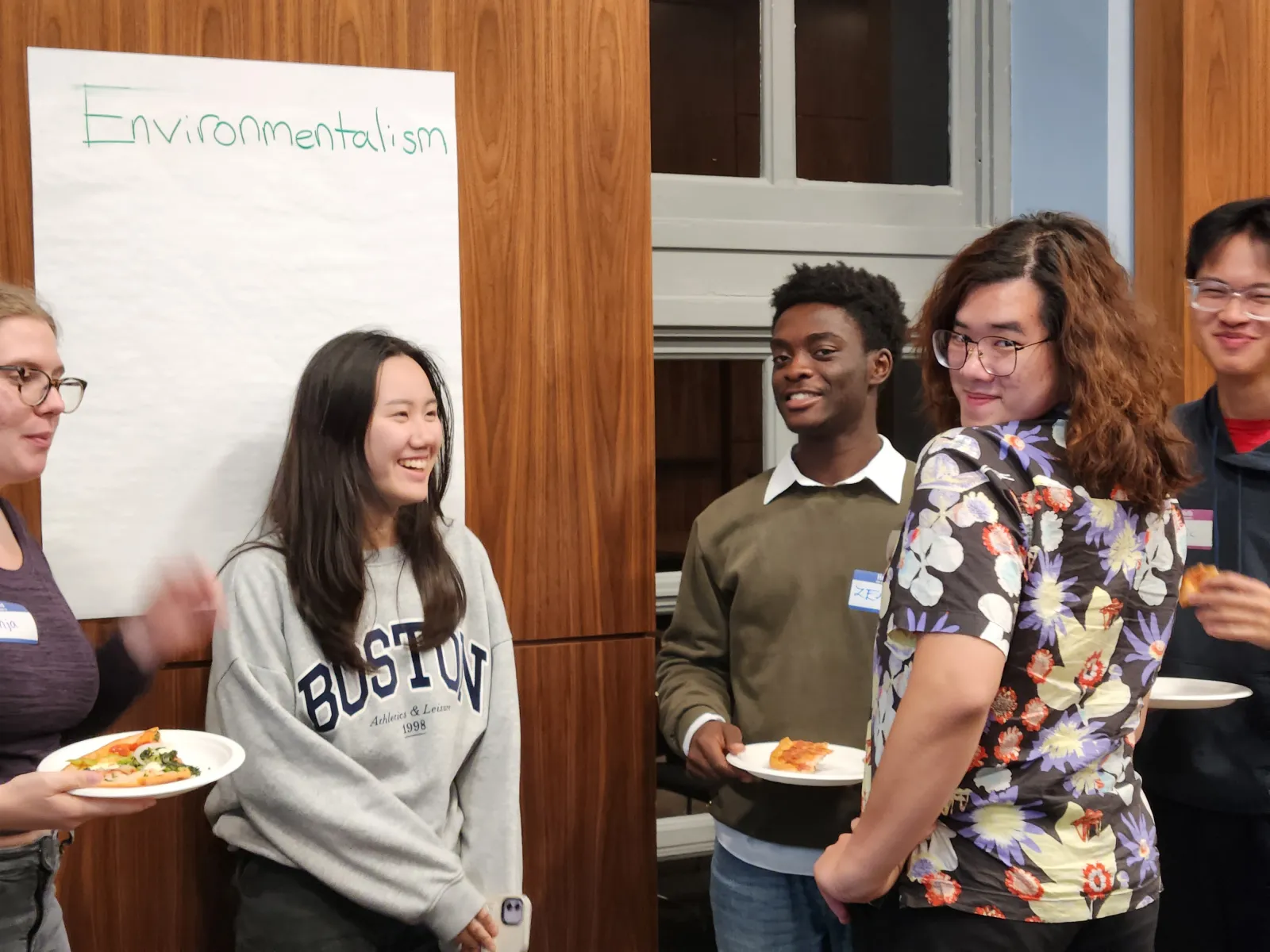 Student group forming over shared interest of Environmentalism as they pose for the camera