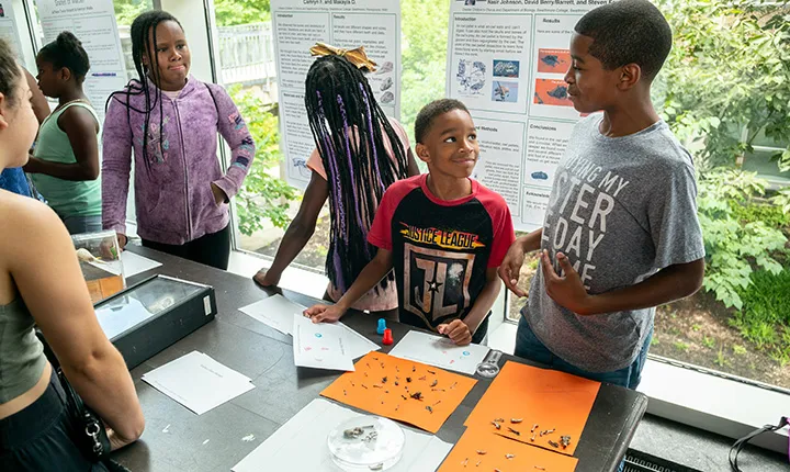 Two boys examine bones at science fair