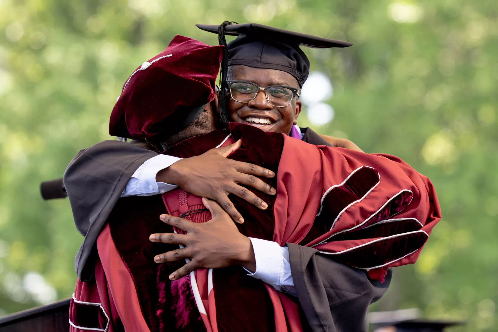 Student hugs president Smith