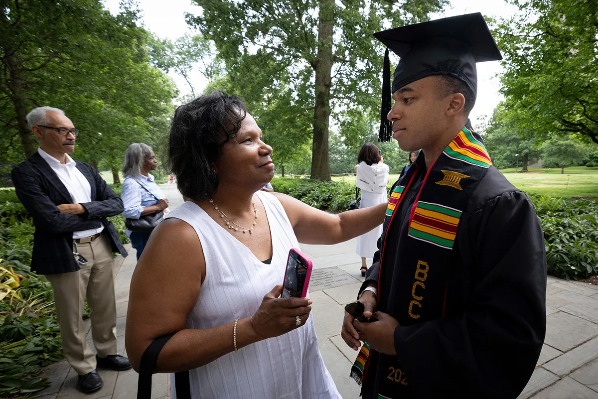 Student and parent talk after baccalaureate ceremony