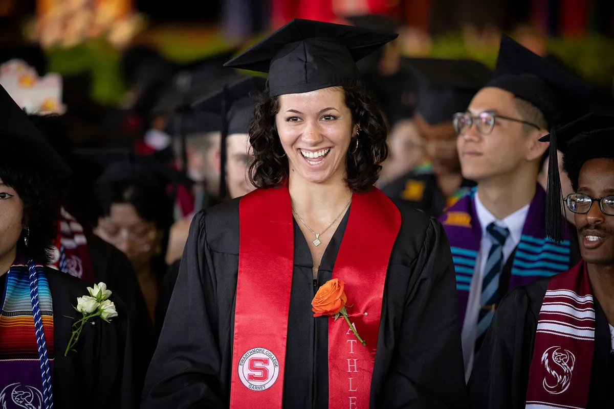 Student smiles during commencement ceremony