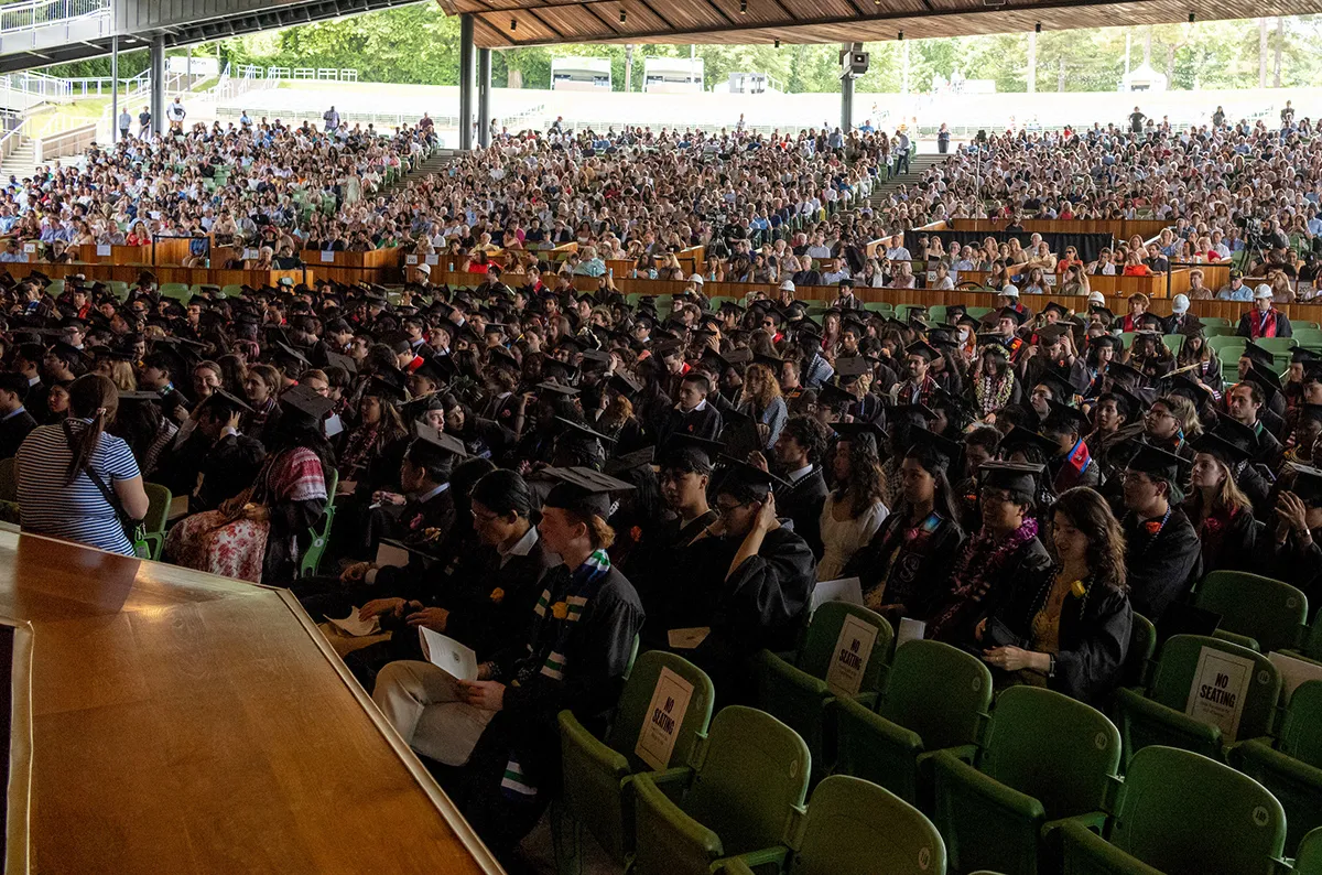 Class of 2024 sits and looks toward stage